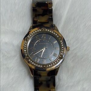 Anne Klein Tortoise Shell Watch with Crystal Accents, water resistant 100 FT